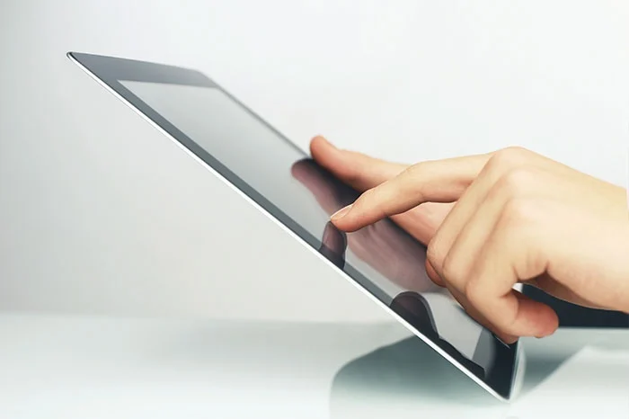 Person holding a tablet